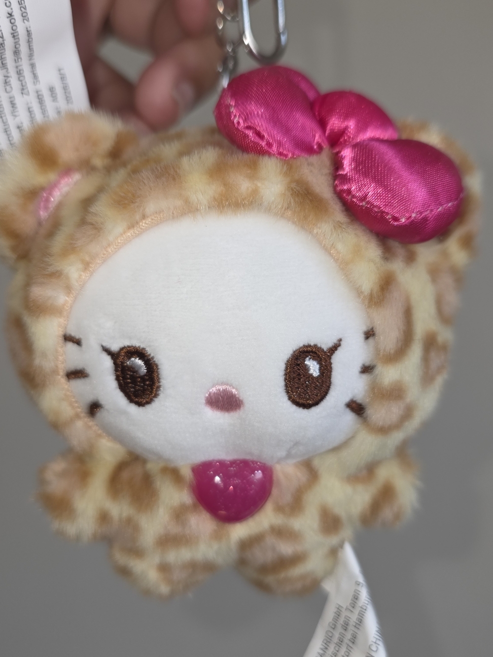 Sanrio Hello Kitty Keychain in Beige Leopard Print with Pink Bow